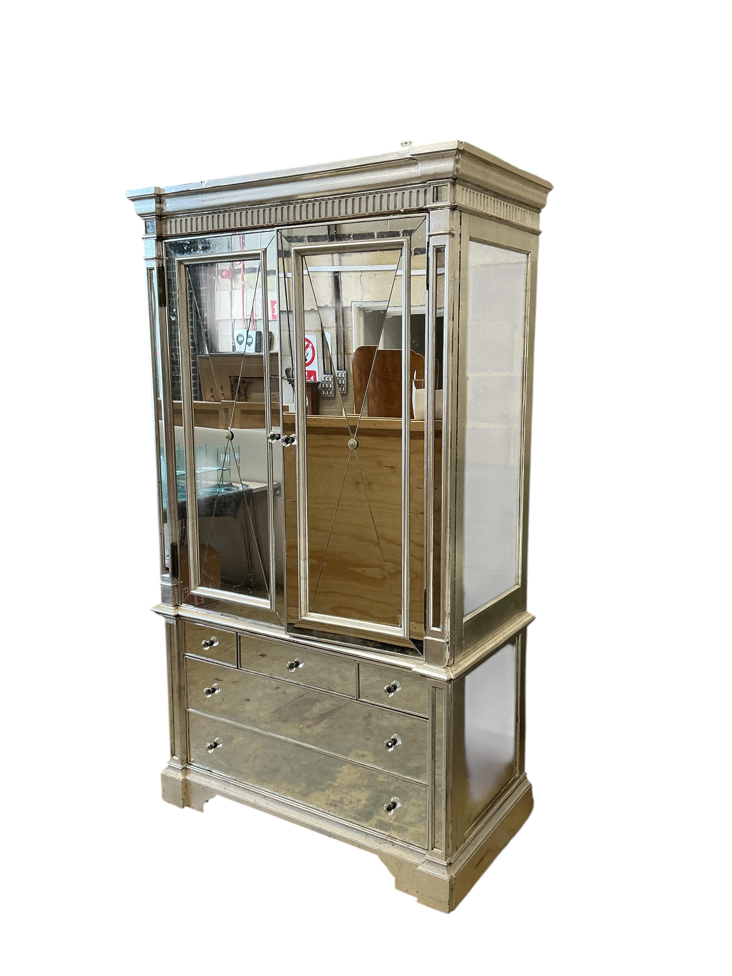 A contemporary mirrored media cabinet, width 144cm, depth 67cm, height 22cm